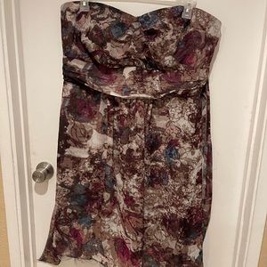 Strapless dress with crinoline lined skirt. Ties in the back.